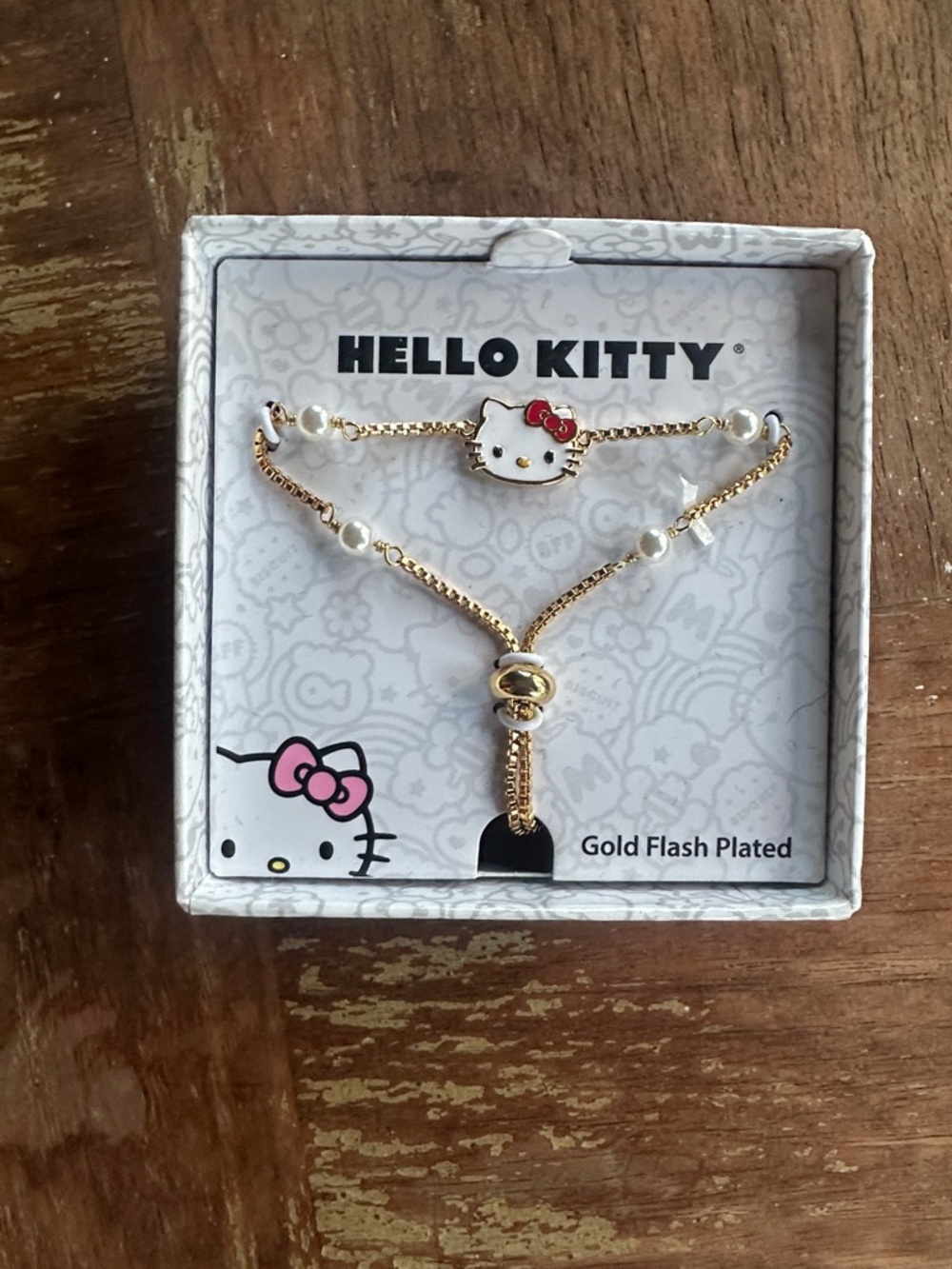 Hello Kitty Gold Flash Plated Bracelet with White & Red Accents